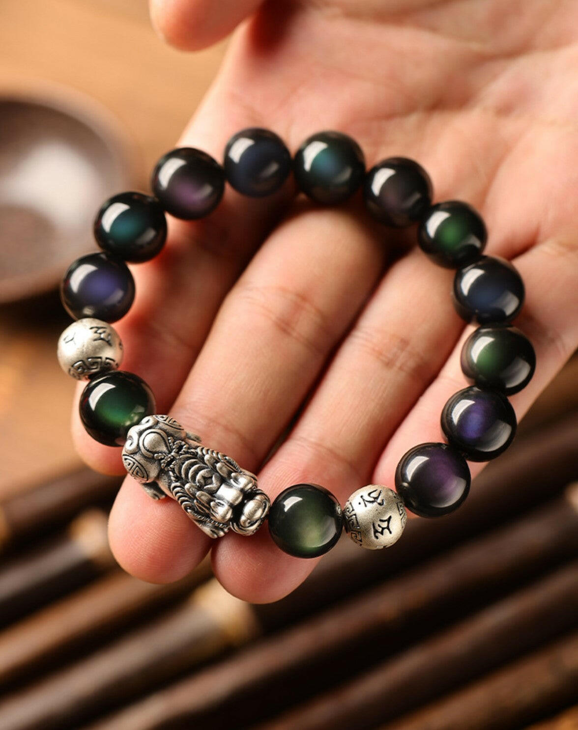 Natural Rainbow Obsidian Bracelet with Pixiu Charm for Wealth and Protection.