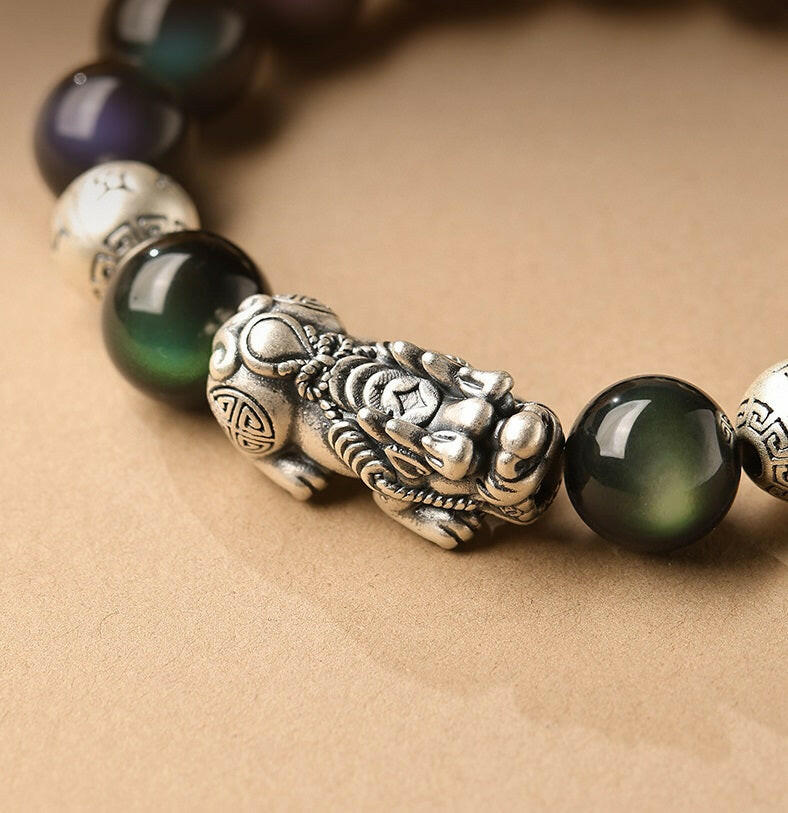 Natural Rainbow Obsidian Bracelet with Pixiu Charm for Wealth and Protection.