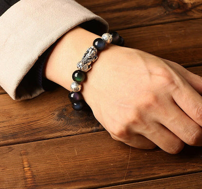 Natural Rainbow Obsidian Bracelet with Pixiu Charm for Wealth and Protection.
