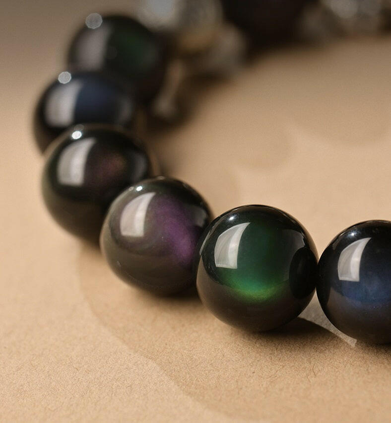 Natural Rainbow Obsidian Bracelet with Pixiu Charm for Wealth and Protection.